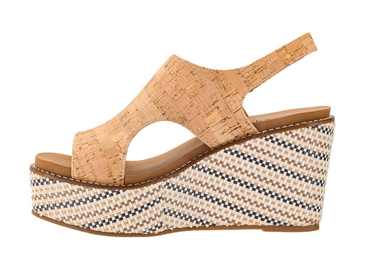 Woven wedge sandal with cork wedge on a white background