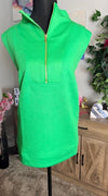 Green sleeveless dress with a zipper on a mannequin against a neutral background