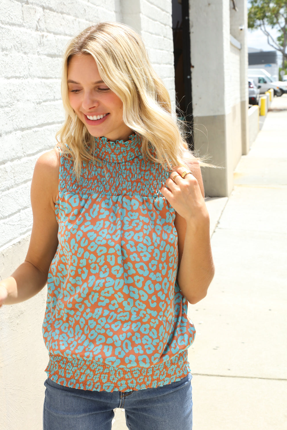 Dazzle In Teal Smocked High Neck Animal Print Sleeveless Top