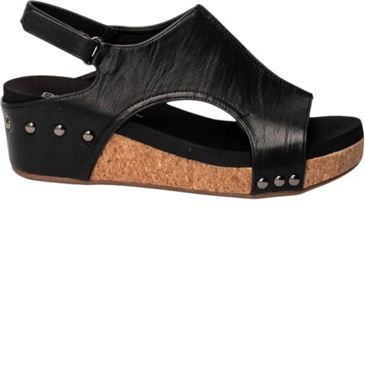 Black sandal with cork sole on a white background