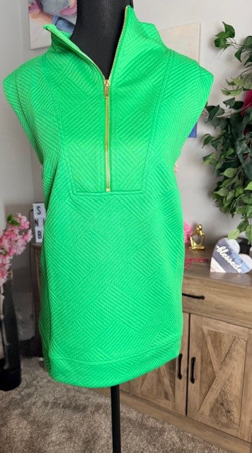 Green sleeveless dress with a zipper on a mannequin against a neutral background